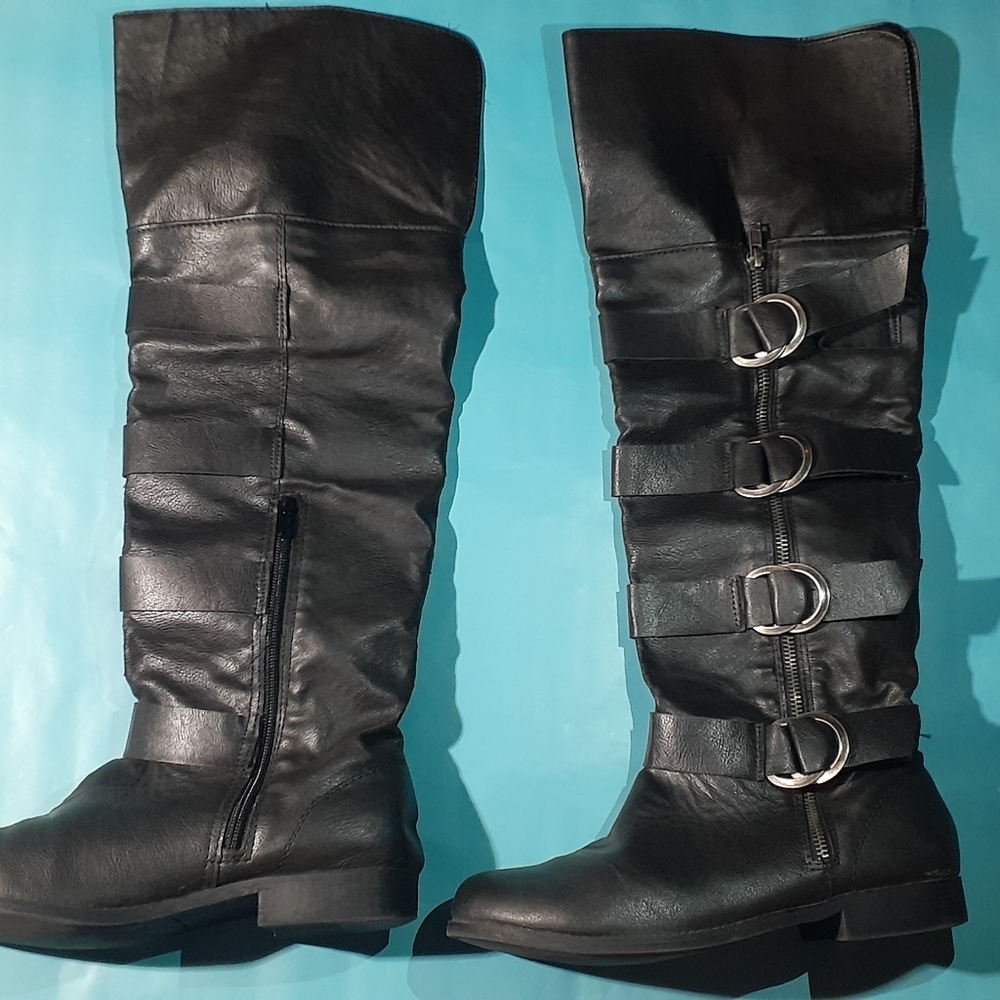 Black Knee high boots with silver buckles.